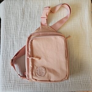 Pink Crossbody Bag With Interchangeable Strap.
